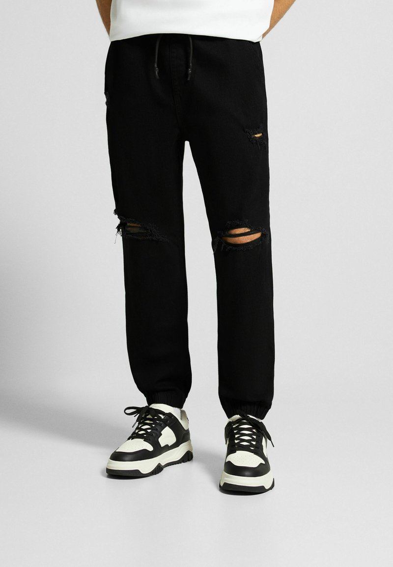 Bershka RIPPED JOGGER  - Jeans Relaxed Fit